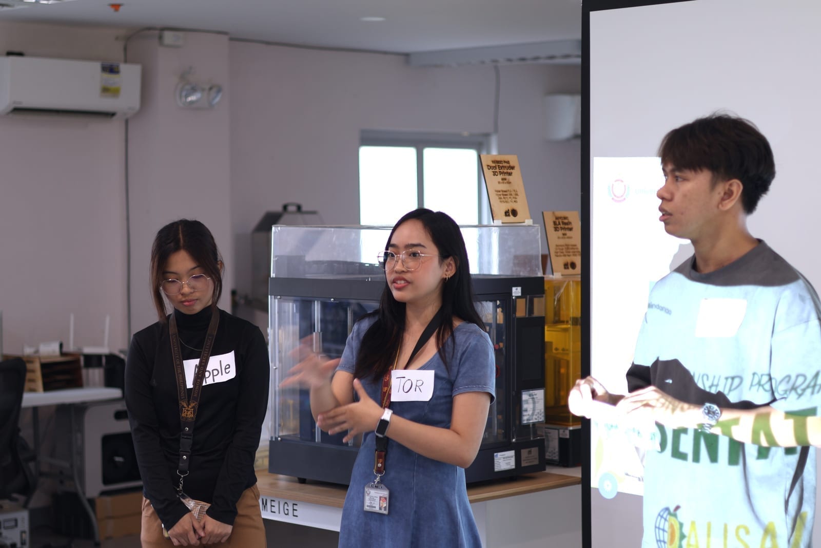 Interns presenting their group's ideas during the collaborative exercise