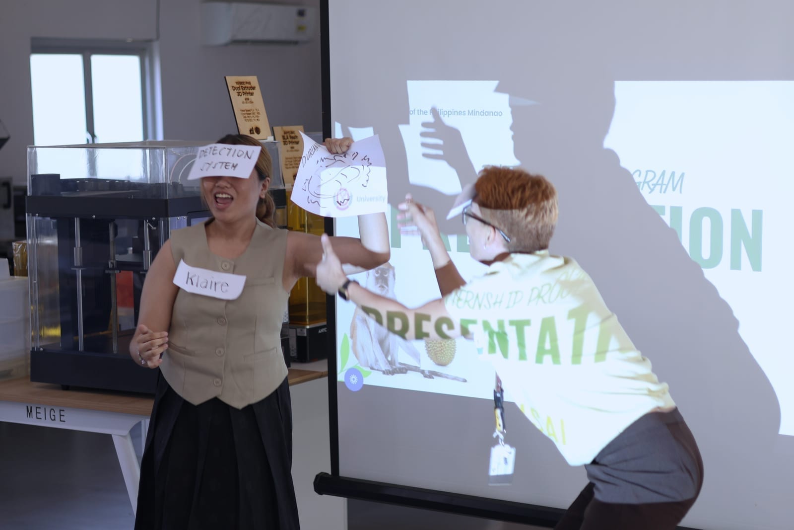 Two interns presenting their proposed solution during the collaborative activity