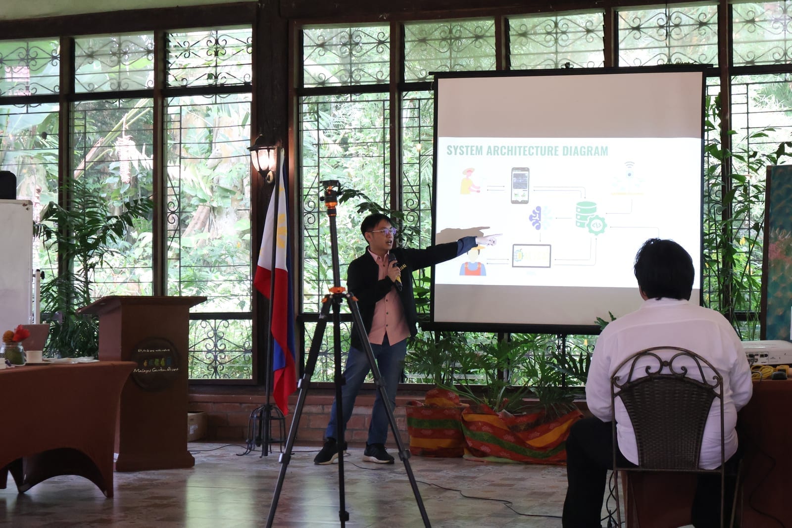Harold Clyde Valiente presenting the DALISAI 2.0 system architecture diagram